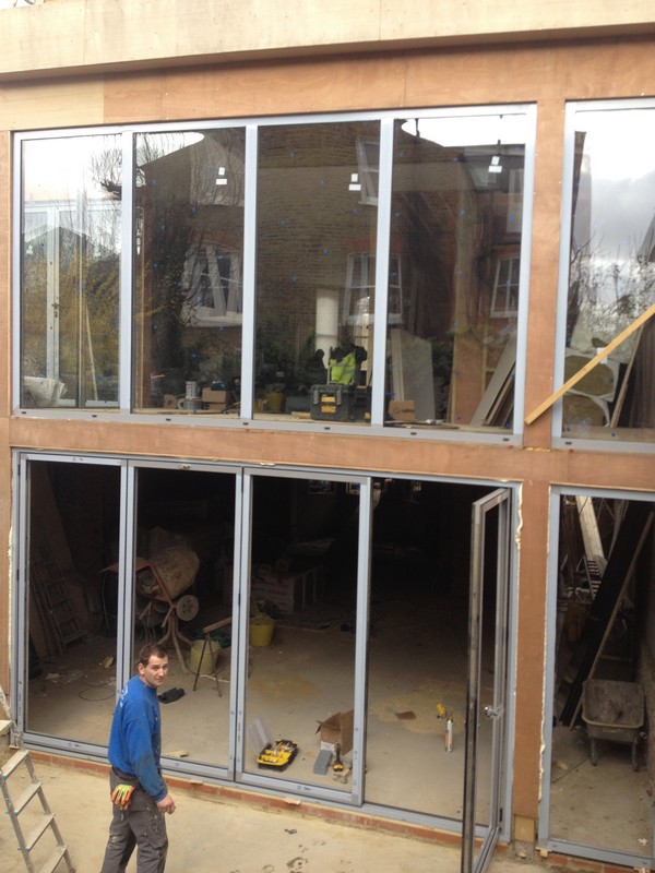 Aluminium bi-fold doors with two-storey glazing in Leighton Buzzard